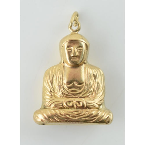 319 - 9ct gold charm in the form of a buddha, 0.9 grams.