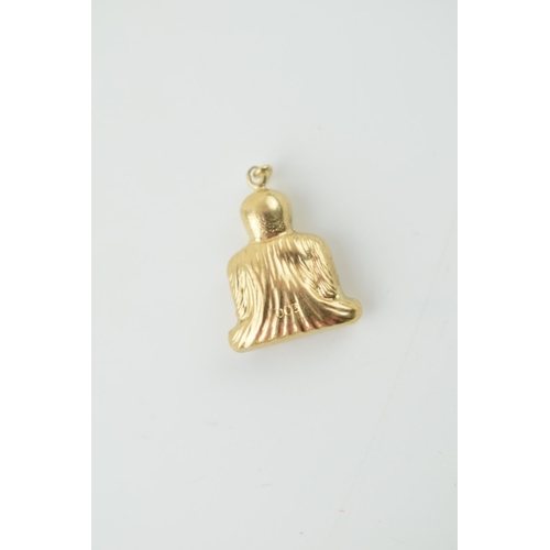 319 - 9ct gold charm in the form of a buddha, 0.9 grams.