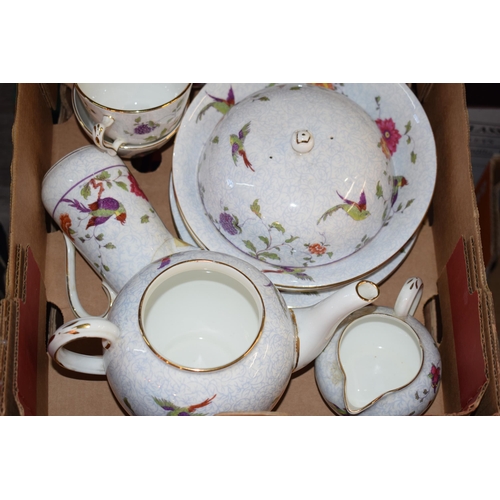 51 - A collection of tea and dinner ware by Crown Staffordshire in the Bird of Paradise pattern. To inclu... 