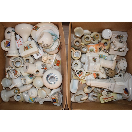 53 - A collection of crested china items to include animals, jugs, vases and varying forms and decoration... 
