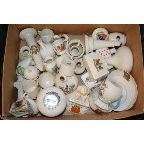 53 - A collection of crested china items to include animals, jugs, vases and varying forms and decoration... 