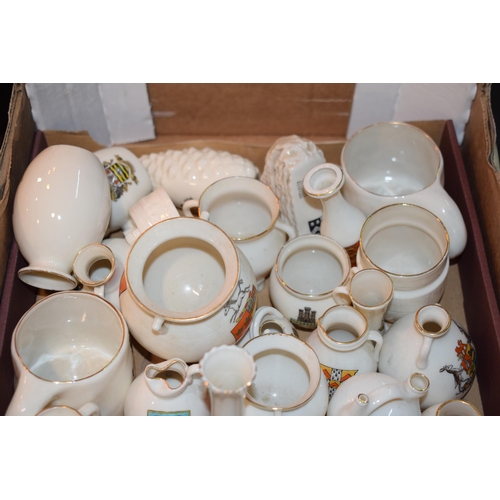 54 - A collection of Goss crested china items to include jugs, vases and varying forms and decoration (Qt... 