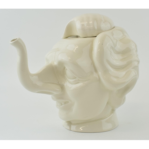 109 - Spitting Image Margaret Thatcher teapot by Fluck and Law, made by Carlton Ware, unmarked, 31cm long.