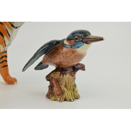 145 - Damaged Beswick animals to include a tiger, a Guernsey cow and a kingfisher (3 - all damaged).