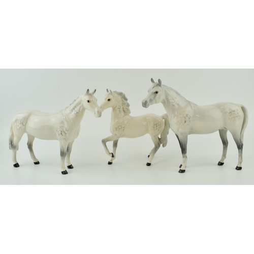 146 - Beswick grey horses to include a prancing arab, an arab bahram and one other (3).