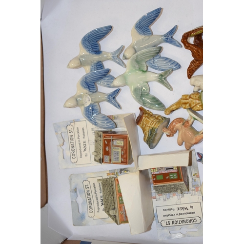 34 - Wade Whimsies to include swallows, Disney Hatbox figure, Coronation Street houses, a Goebel bear and... 