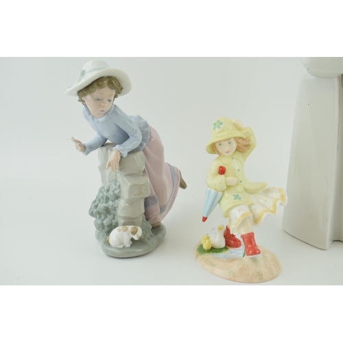 49 - A Lladro figure of two nuns, 33cm tall, a Nao girl with a puppy and a Royal Doulton Follow Me figure... 