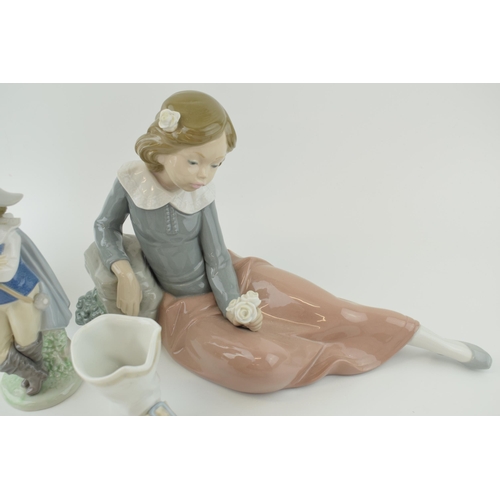 50 - A collection of Nao to include a Cavalier, a boot, a girl in a green dress and a girl playing with f... 