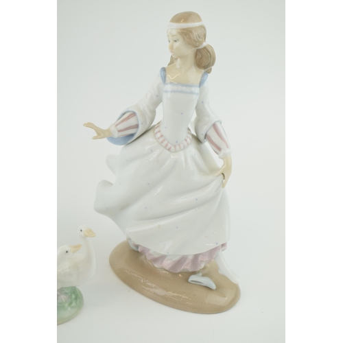 54 - A trio of figures to include a Lladro girl 4820 with a Nao girl with geese and a girl in a frilly dr... 