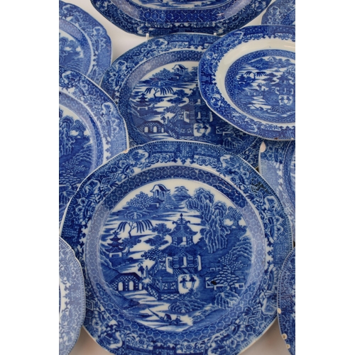 60 - A group of late 18th century pearlware blue and white transfer-printed “Two Figures” pattern dinner ... 