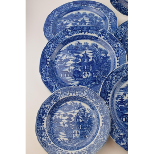 60 - A group of late 18th century pearlware blue and white transfer-printed “Two Figures” pattern dinner ... 