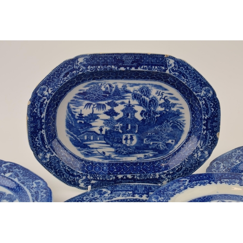 60 - A group of late 18th century pearlware blue and white transfer-printed “Two Figures” pattern dinner ... 