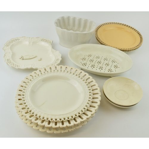 65 - A group of late 18th, early 19th century creamware dessert wares, including pierced plates, dishes, ... 