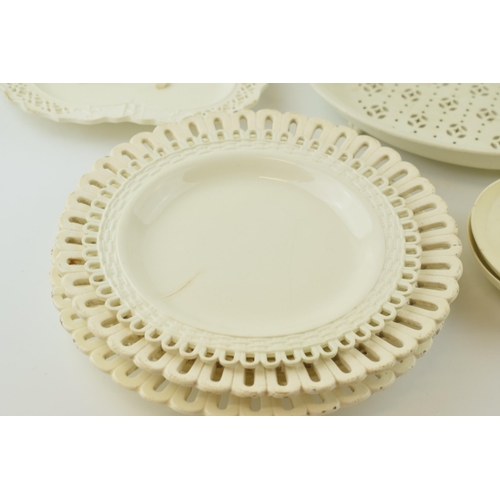 65 - A group of late 18th, early 19th century creamware dessert wares, including pierced plates, dishes, ... 