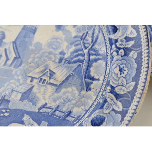 74 - A group of early 19th century blue and white transfer-printed dinner wares, to include five Village ... 