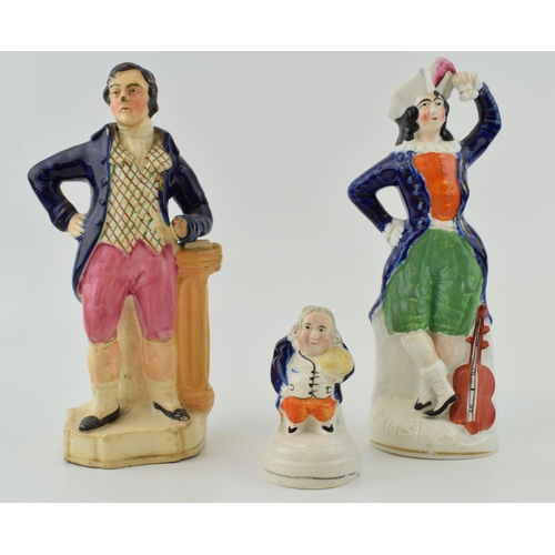 76 - A group of Victorian Staffordshire Figures, including a lady with violin, tallest 21cm (3).