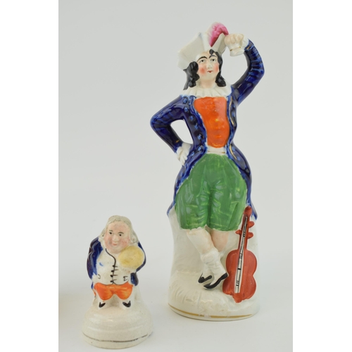 76 - A group of Victorian Staffordshire Figures, including a lady with violin, tallest 21cm (3).