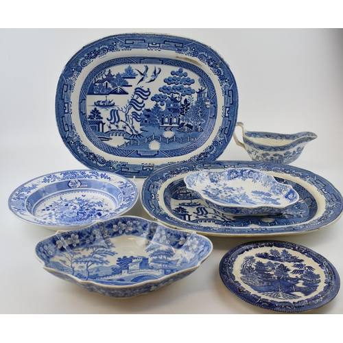 84 - A group of early 19 th century blue and white transfer-printed wares, to include: two
Willow pattern... 