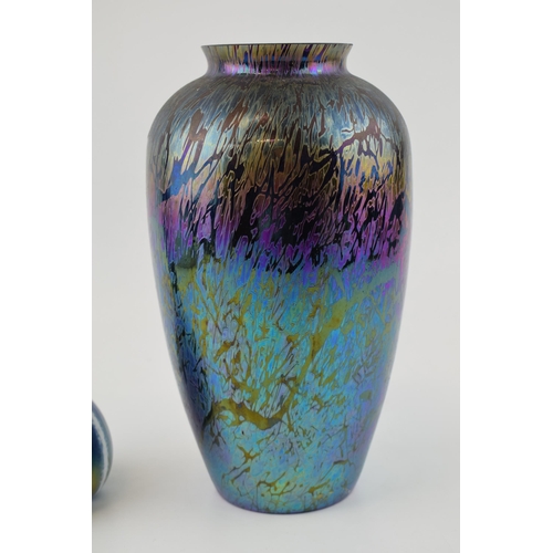 88 - A good pair of iridescent studio art glass to include an onion shaped vase with elongated neck, 27cm... 