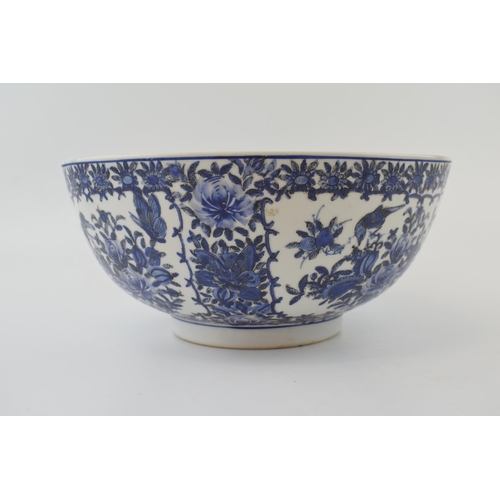 98 - A large blue and white Chinese bowl with character marks to the base. 10” wide.