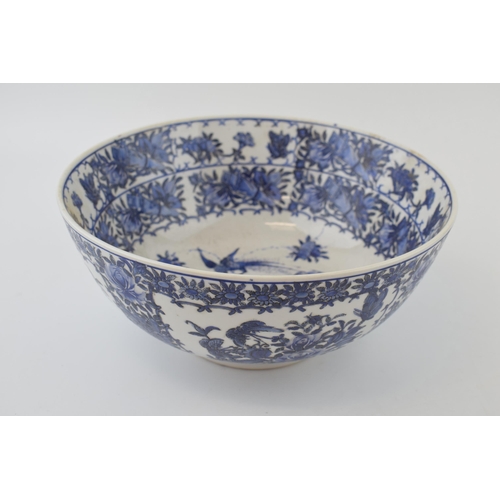 98 - A large blue and white Chinese bowl with character marks to the base. 10” wide.