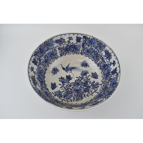 98 - A large blue and white Chinese bowl with character marks to the base. 10” wide.