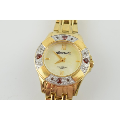 285 - Ingersoll 100M water resistant lady's quartz watch, stone set bezel, untested, gilt bracelet.