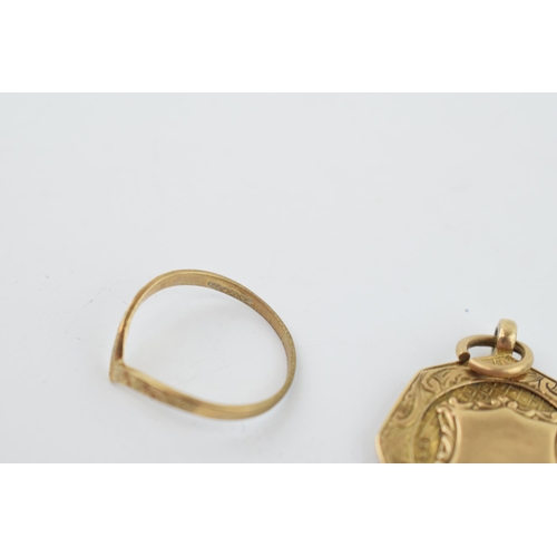 287 - A 9ct yellow gold fob together with a 9ct yellow ladies ring. 6.4 grams.