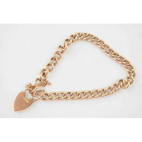 A 9ct gold bracelet with heart shaped padlock and safety chain. Weight 8.2 grams