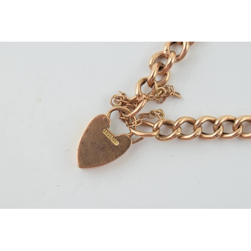 291 - A 9ct gold bracelet with heart shaped padlock and safety chain. Weight 8.2 grams