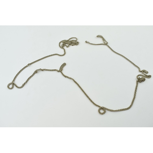 296 - A white metal antique longuard chain. Length 160cm.