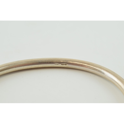 298 - Hallmarked silver torque bangle, 40.0 grams, 8cm wide.