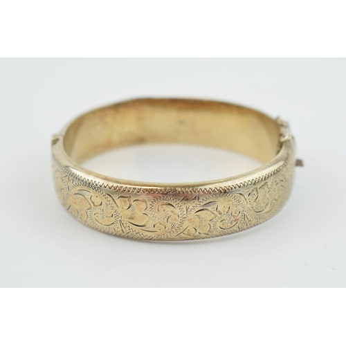 314 - Hallmarked silver bangle, engraved decoration, 25.9 grams.