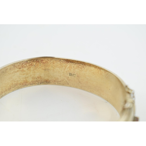 314 - Hallmarked silver bangle, engraved decoration, 25.9 grams.