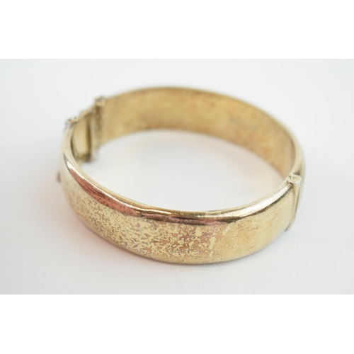 314 - Hallmarked silver bangle, engraved decoration, 25.9 grams.