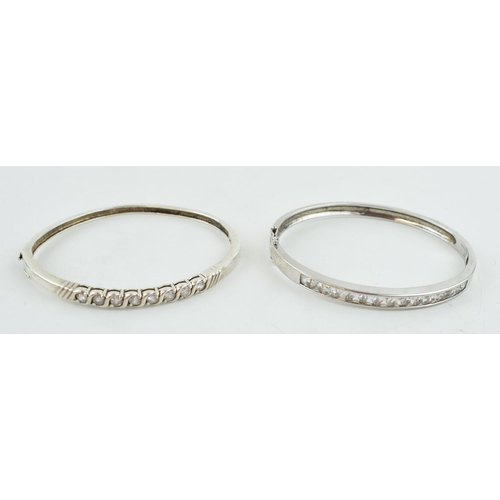 315 - A pair of sterling silver and stone set bangles, 35.0 grams (2).