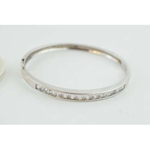 315 - A pair of sterling silver and stone set bangles, 35.0 grams (2).