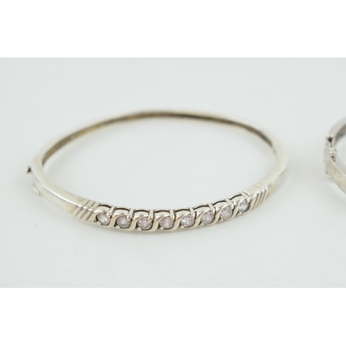 315 - A pair of sterling silver and stone set bangles, 35.0 grams (2).