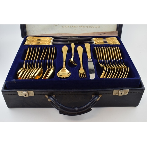 325 - A cased Solingen 24k gold plated cutlery set, in leather brief case, with 3 trays of cutlery, all in... 