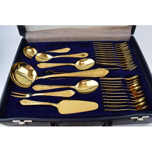 325 - A cased Solingen 24k gold plated cutlery set, in leather brief case, with 3 trays of cutlery, all in... 