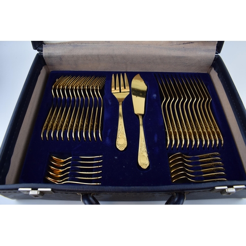 325 - A cased Solingen 24k gold plated cutlery set, in leather brief case, with 3 trays of cutlery, all in... 