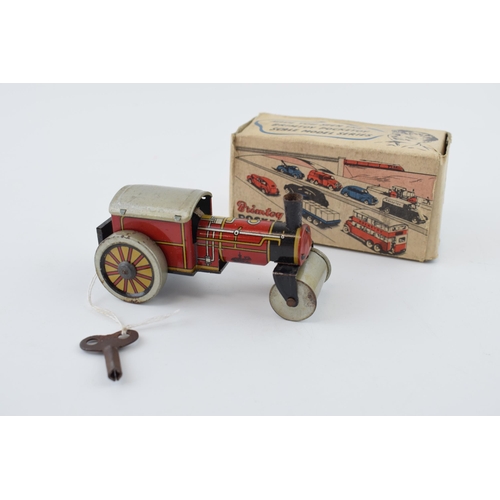 329 - Boxed Brimtoy 'British Made' 9/501 clockwork 'Steamer' tin toy in working order with key.  Height 5c... 