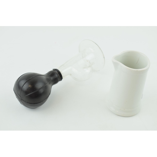 343 - An antique Boots Chemists 'Breast Pump' PAT. March 17, 1891, together with a Maddock and Sons milk j... 