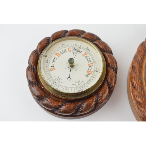 350 - A barometer with intergrated thermometer. Golden oak case. White dial with brass hand. Diameter 22cm... 