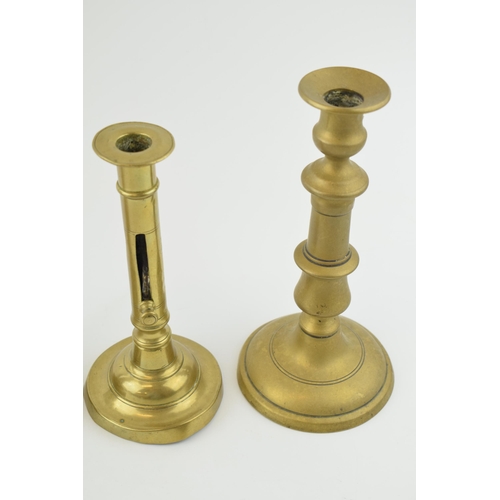 353 - Two pairs of early brass candle sticks with spun bases. One pair benefiting from having height adjus... 