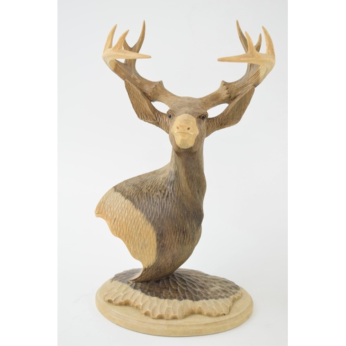 365 - A pair of contemporary highly detailed carved softwood busts in the form of highland stags, freestan... 