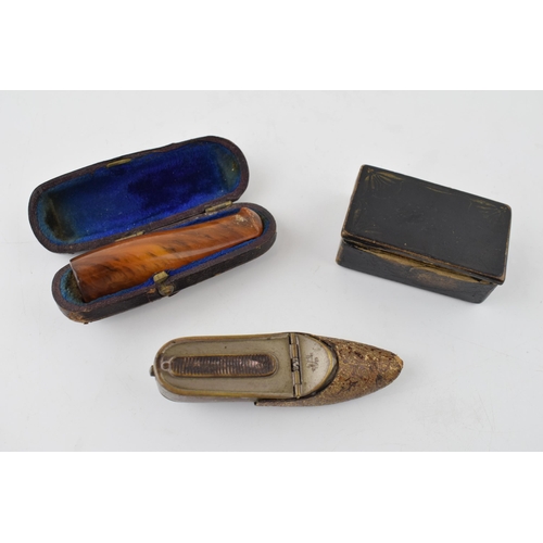 369 - A collection of items to include an
 cased amber cigar holder, paper mâché snuff box and a vesta cas... 