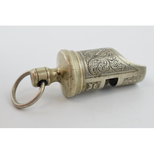 370 - An antique whistle, possibly a safety whistle with monogram. 6cm.