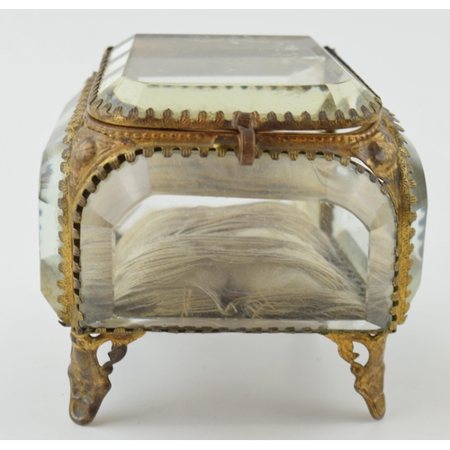 373 - A vintage Ormolu jewellery box. Heavy glass with brass frame.  inscribed to lid. Height 7.5cm.