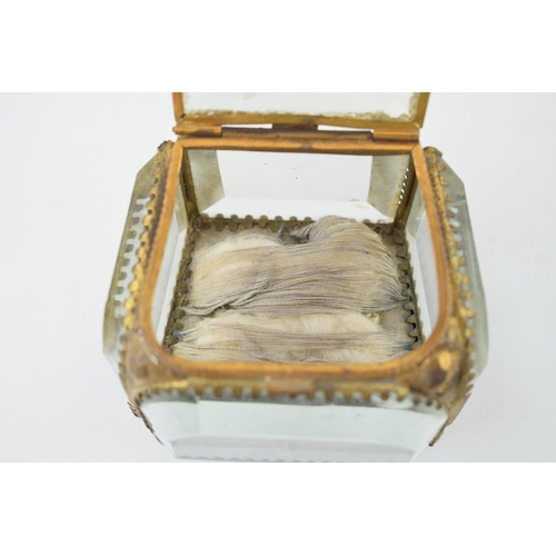 373 - A vintage Ormolu jewellery box. Heavy glass with brass frame.  inscribed to lid. Height 7.5cm.